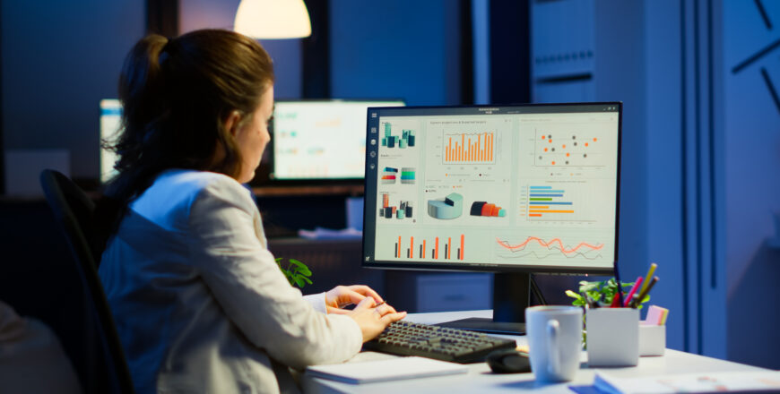 busy-woman-working-night-front-computer-taking-notes-writing-notebook-annual-reports-checking-financial-project-focused-employee-using-technology-network-wireless-doing-overtime-job